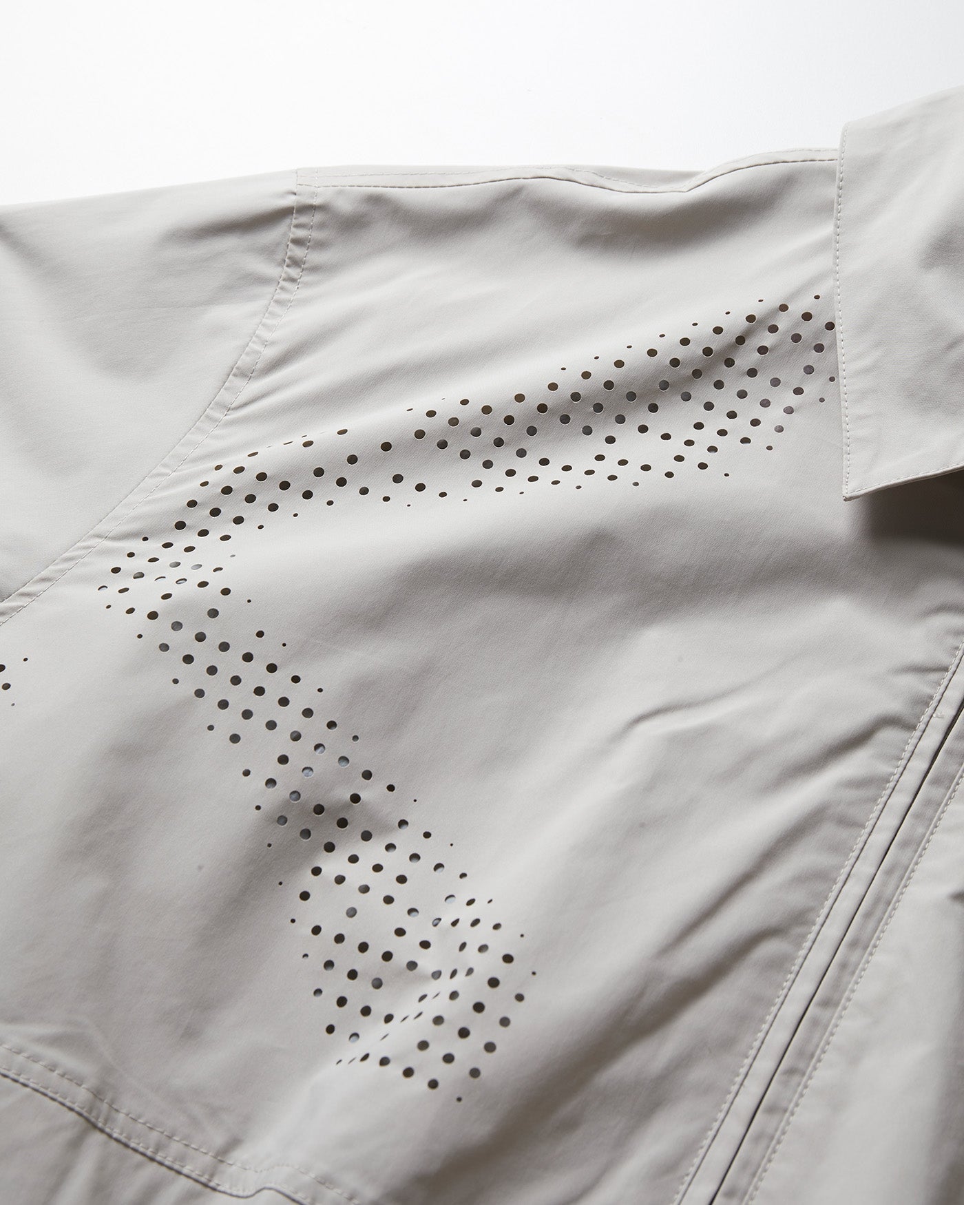 NINE POINT NINE SPIRAL LASER COACH JACKET-IVORY